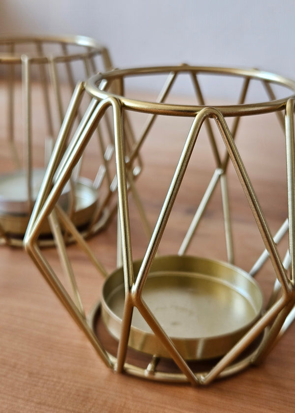 Candelabro dorado para una vela