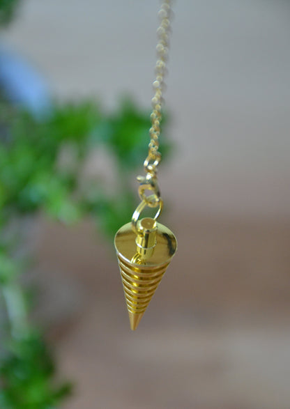 Péndulo espiral dorado